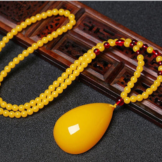 Drop-shaped natural beeswax pendant necklace